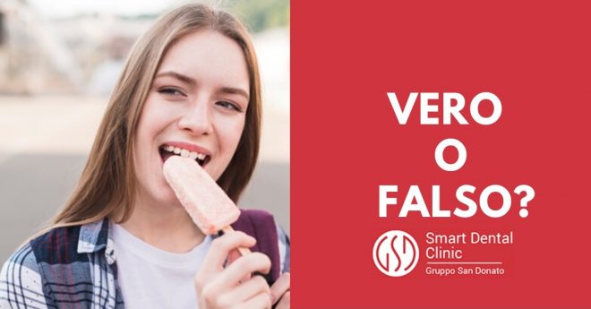 denti-sensibili giovane ragazza sorridente che addenta un ghiacciolo