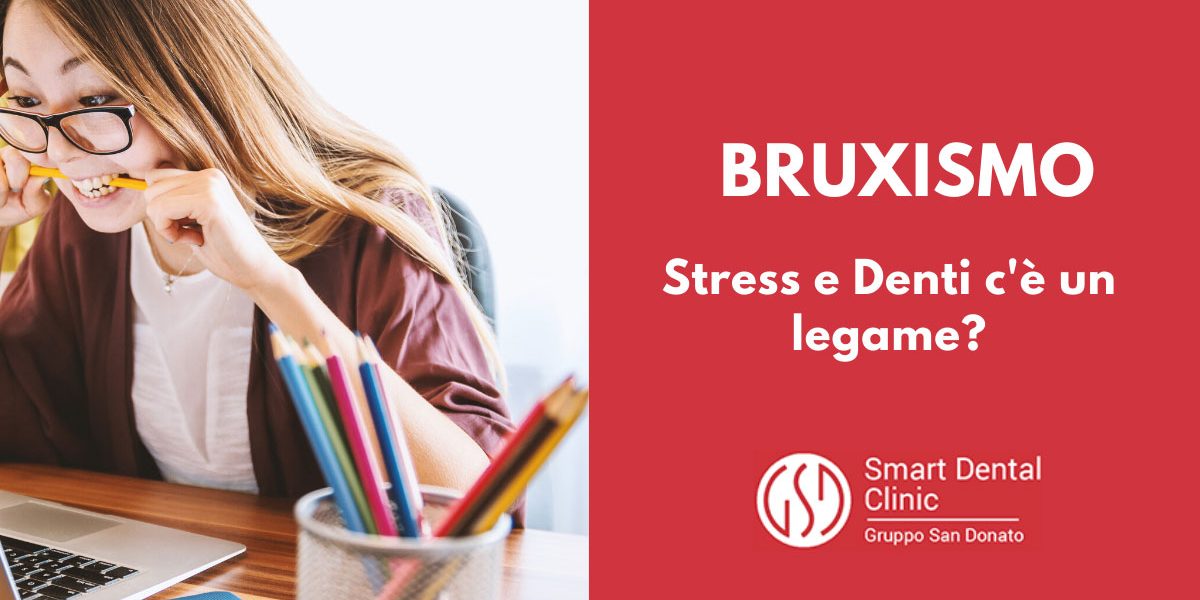 giovane ragazza al computer che stringe tra i denti una matita a causa dello stress